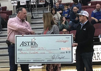 Doug Wiltfong and Mitchell Dickinson of Astra Bank presenting a check to Lisa Gehring of USD 270