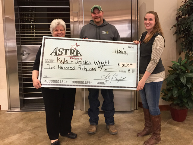 Photo of Kyle Wright, his wife Jessica and Sarah Will, Market President of Astra Bank