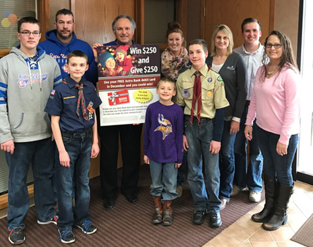 Photo of Matt Cole with family, friends and staff members of our Belleville location